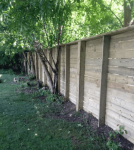 Fence with fence posts facing towards viewer.